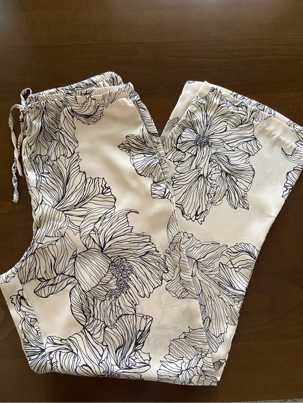 H&M Cream Drawstring Floral Silky Pants with Black Floral Linework, size S. NWOT